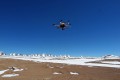 This strange looking contraption is a hexacopter, installed with a camera, which can be used for radio-controlled aerial cinematography and photography. In the background the Atacama Large Millimeter/submillimeter Array (ALMA) sprawls out across the Chajnantor Plateau in Chile soon to be photographed from above.